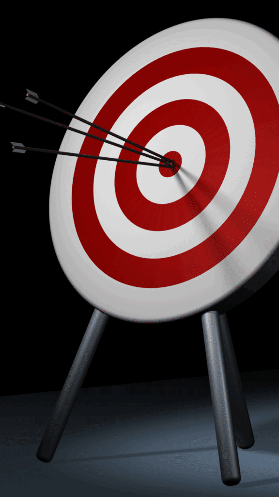 Close-up of a red and white target with multiple arrows hitting the bullseye, representing precise ad targeting and campaign effectiveness.