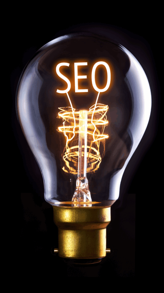 A close-up of a glowing lightbulb with the word “SEO” illuminated inside, representing the power and impact of digital marketing tactics.