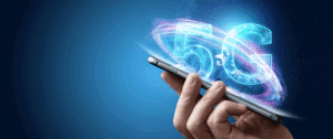 High-resolution digital image of a hand holding a smartphone, with glowing “5G” text and swirling neon light effects emerging from the device, set against a deep blue background. The image represents the transformative power and speed of 5G connectivity in digital communications.