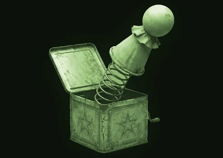 A tin jack-in-the-box with the figure sprung out on its spring.